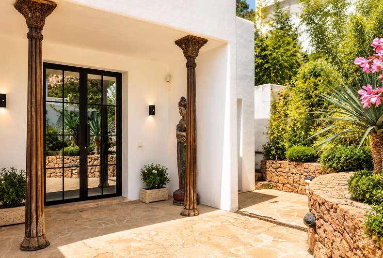 Villa entrance with carved columns