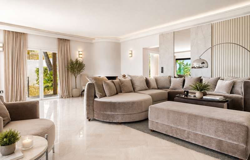 Open-plan living room in warm neutrals