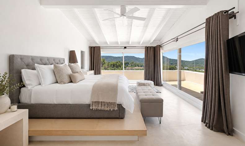 Master suite with vaulted ceiling and terrace