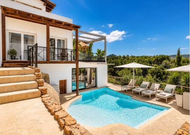 Daytime view of villa, pool and terraces